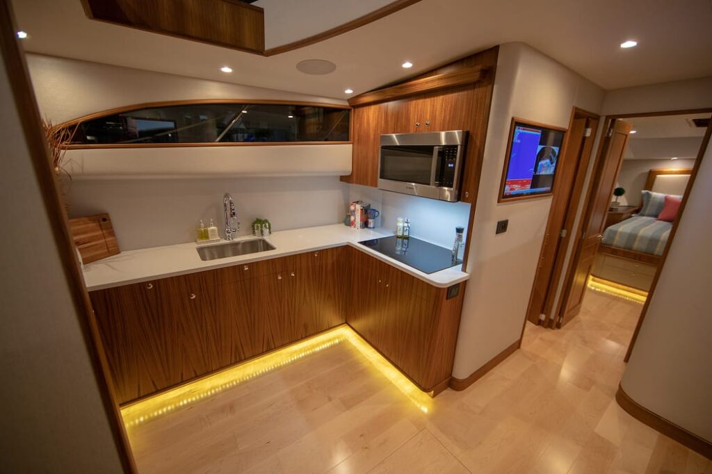 67 JBBW Hull 63_Privateer_pc_Luke Pearson_Interior_Galley-Fwd Staterooms 1